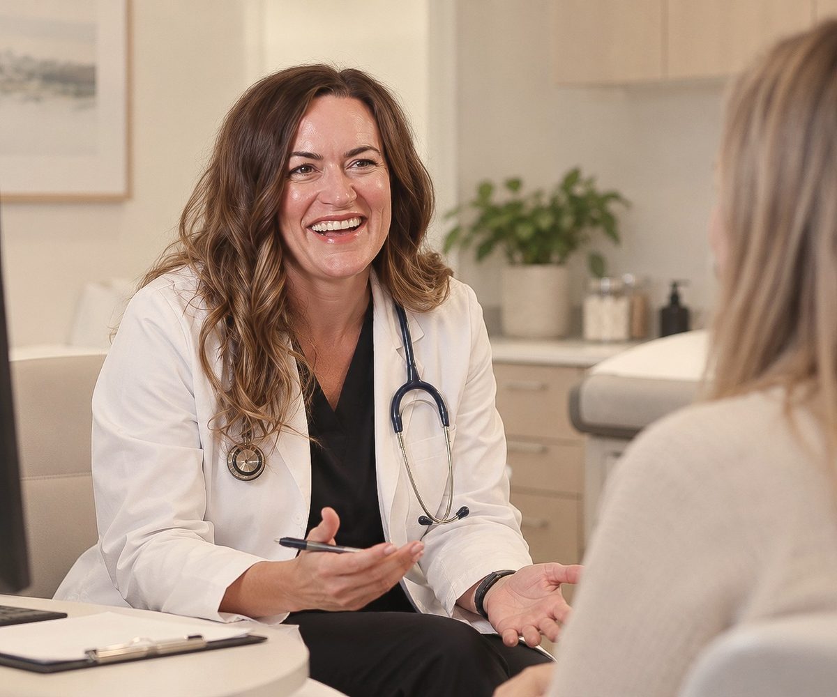 A physician talking with a patient in an exam room